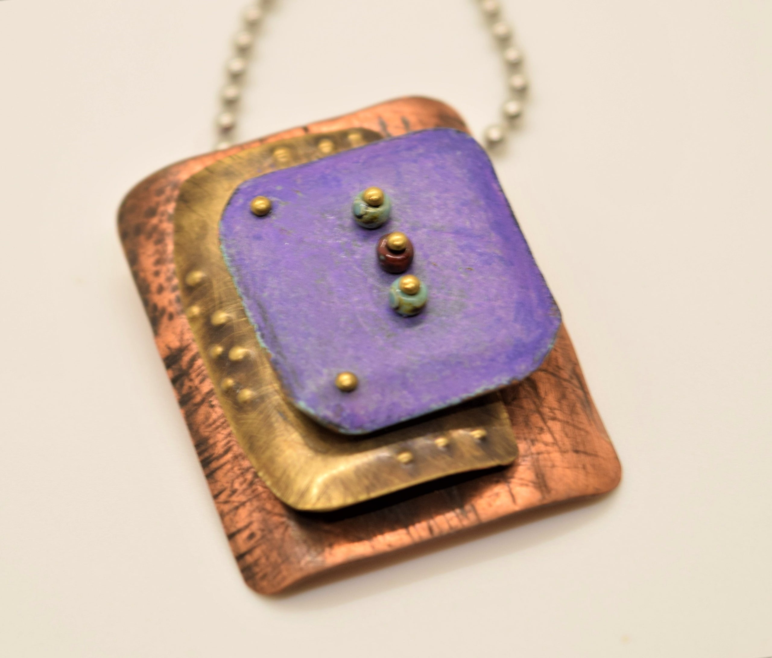 Colored Pencils on Metal Ma Chi Jewelry Designs